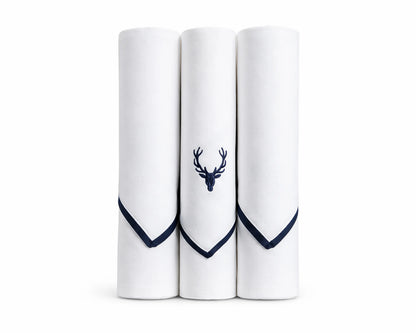 Three white handkerchiefs with navy blue hems and a deer emblem on a white background