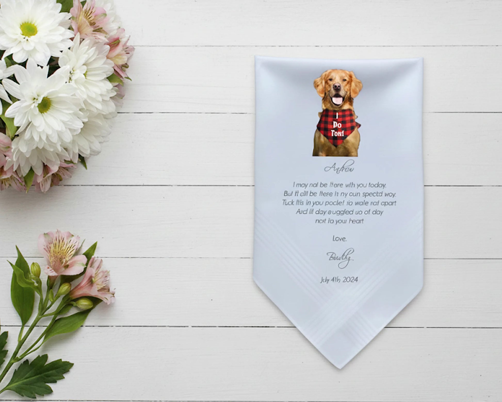 White cotton handkerchief printed with a photo of two dogs and a cat surrounded by purple flowers with the text We Do Too