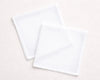 Two white hanky on a light beige background