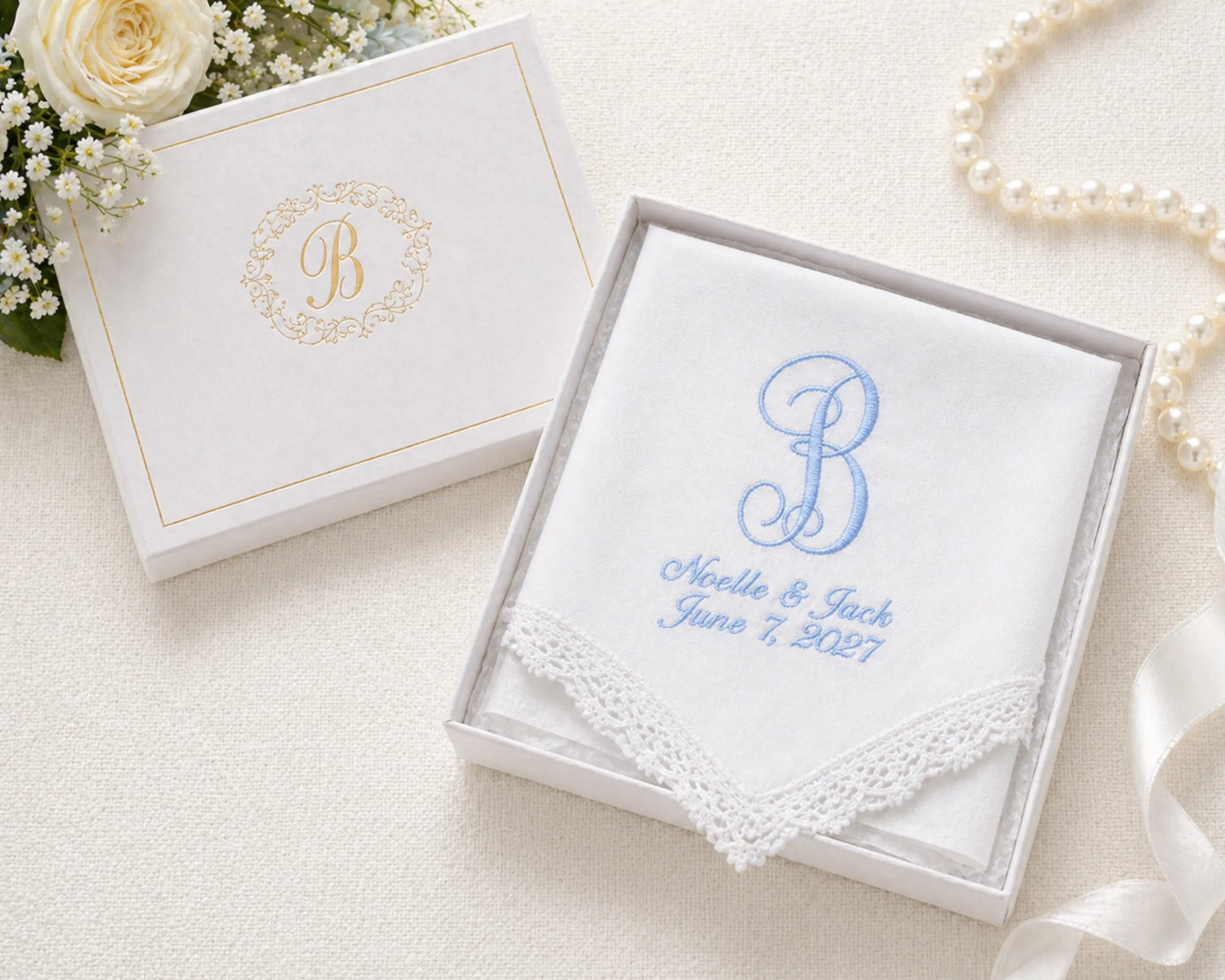 Wedding handkerchief with monogram 'B' and personalized text in a decorative box with flowers and pearls.