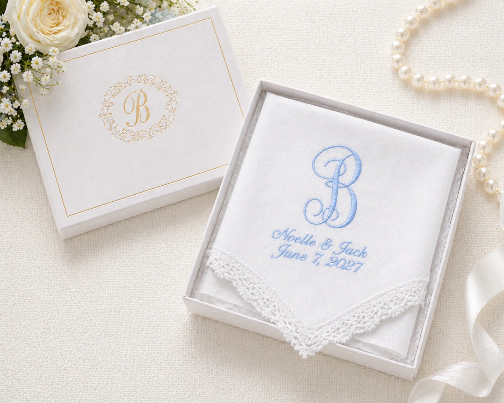 Wedding handkerchief with monogram 'B' and personalized text in a decorative box with flowers and pearls.