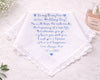 Wedding handkerchief with personalized message and date, placed on a light surface with a bottle of perfume.