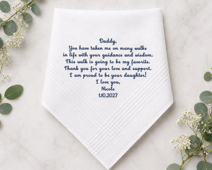 White handkerchief with personalized message on a light background with greenery
