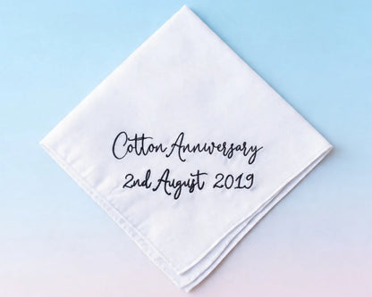 White handkerchief with 'Cotton Anniversary 2nd August 2019' text on a light blue background