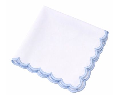 White handkerchief with blue scalloped edge on a white background