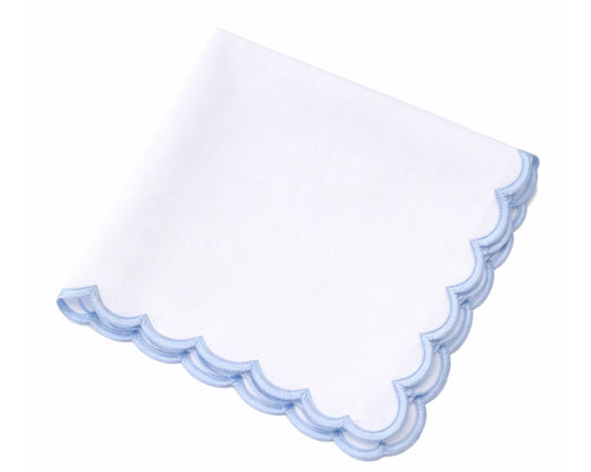White handkerchief with blue scalloped edge on a white background