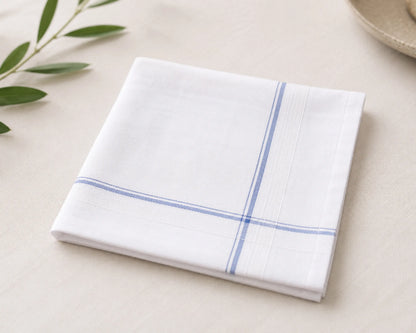 White handkerchief with blue stripes on a light beige surface