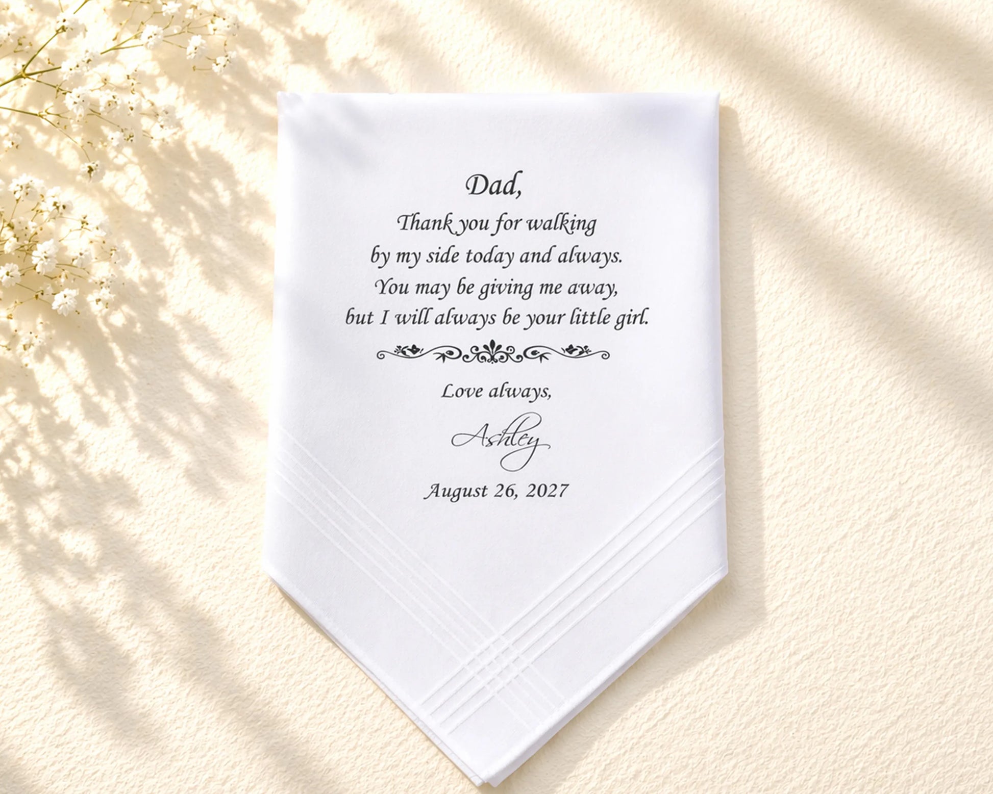 White handkerchief with personalized message on a beige background