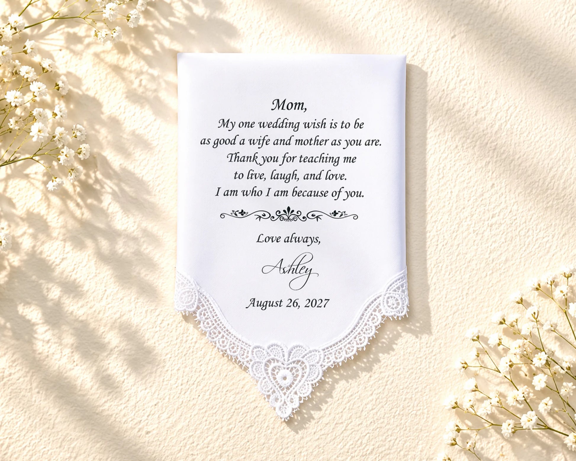 White hanky for mom on a table with a bottle and glass.
