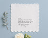White hanky with a heartfelt message on a light blue background