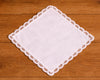 White lace hanky on a wooden surface