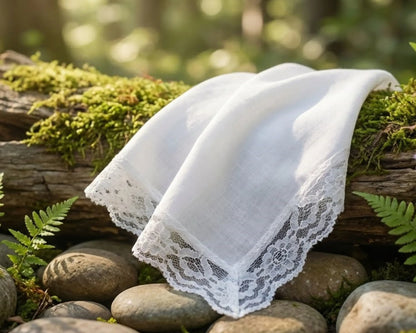 White lace handkerchiefs on a log with a natural background