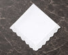 White lace hanky on a dark marble surface