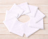 White lace hanky on a wooden surface