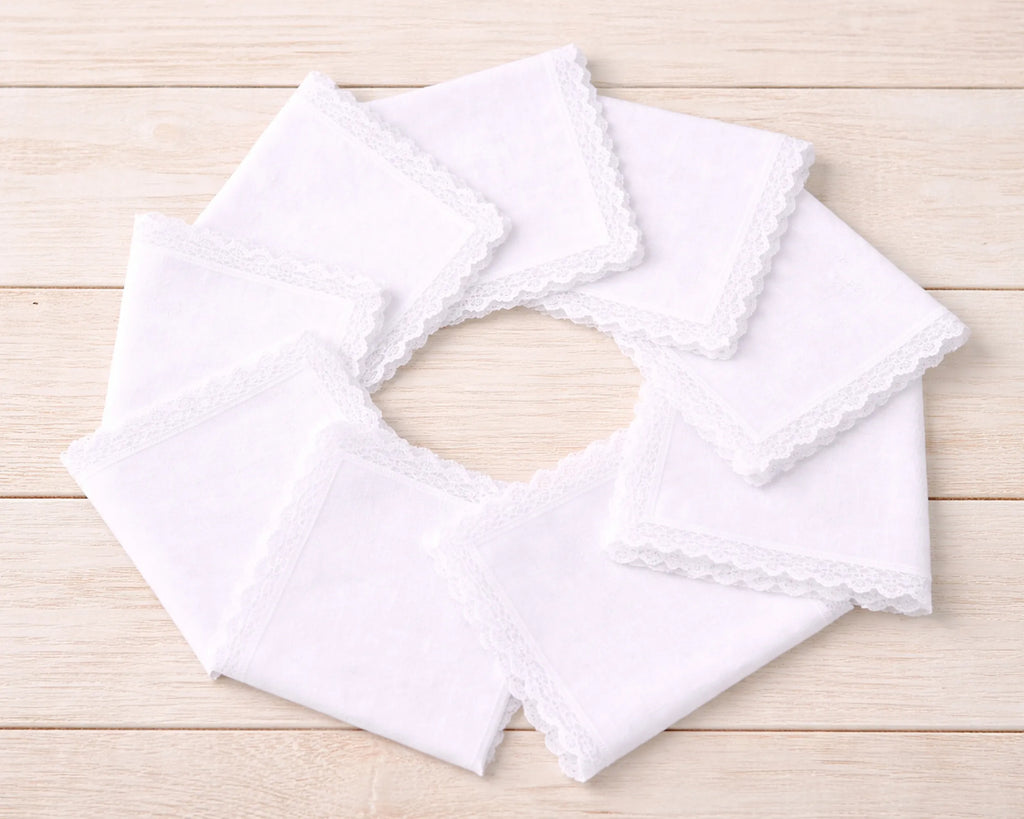 White lace hanky on a wooden surface