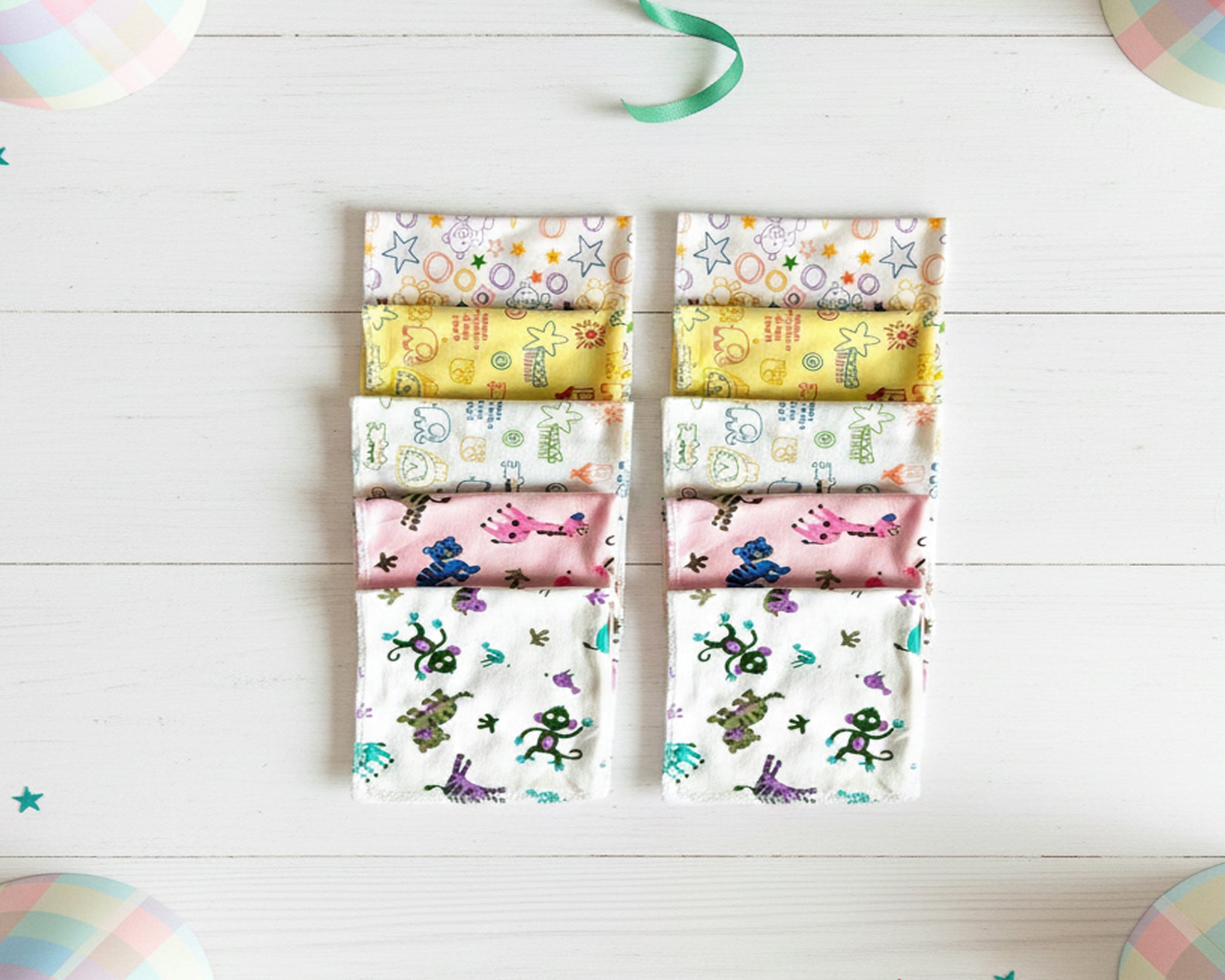 stack of folded cotton handkerchiefs with various character and pattern prints