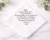 hankie card with heartfelt message to a father on a marble surface with flowers.