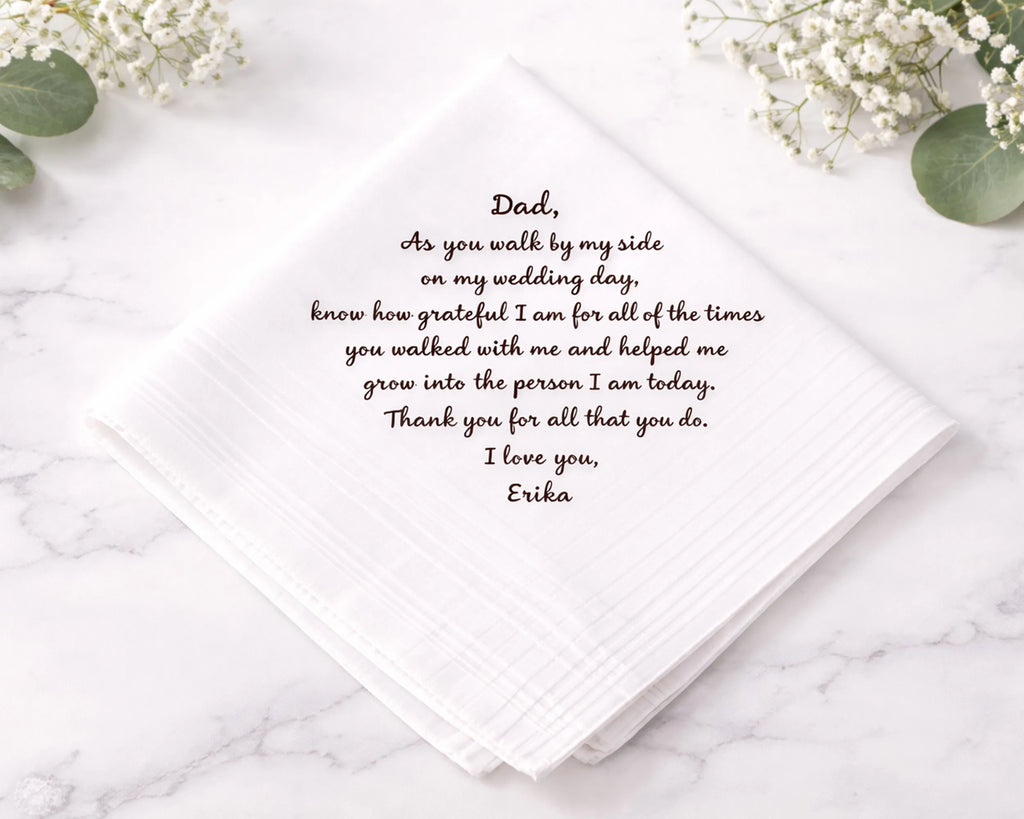 hankie card with heartfelt message to a father on a marble surface with flowers.