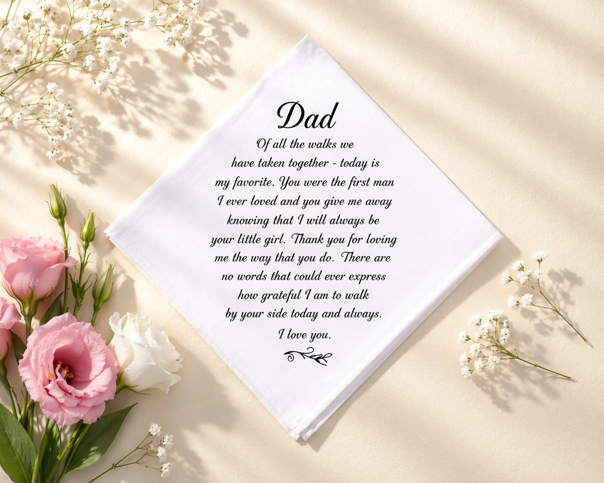 hanky with a heartfelt message to a father surrounded by flowers on a light background