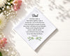 hanky with a message for Dad surrounded by flowers on a light surface