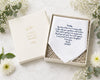 Set of pastel-colored handkerchiefs arranged in a circular pattern on a white surface with flowers.