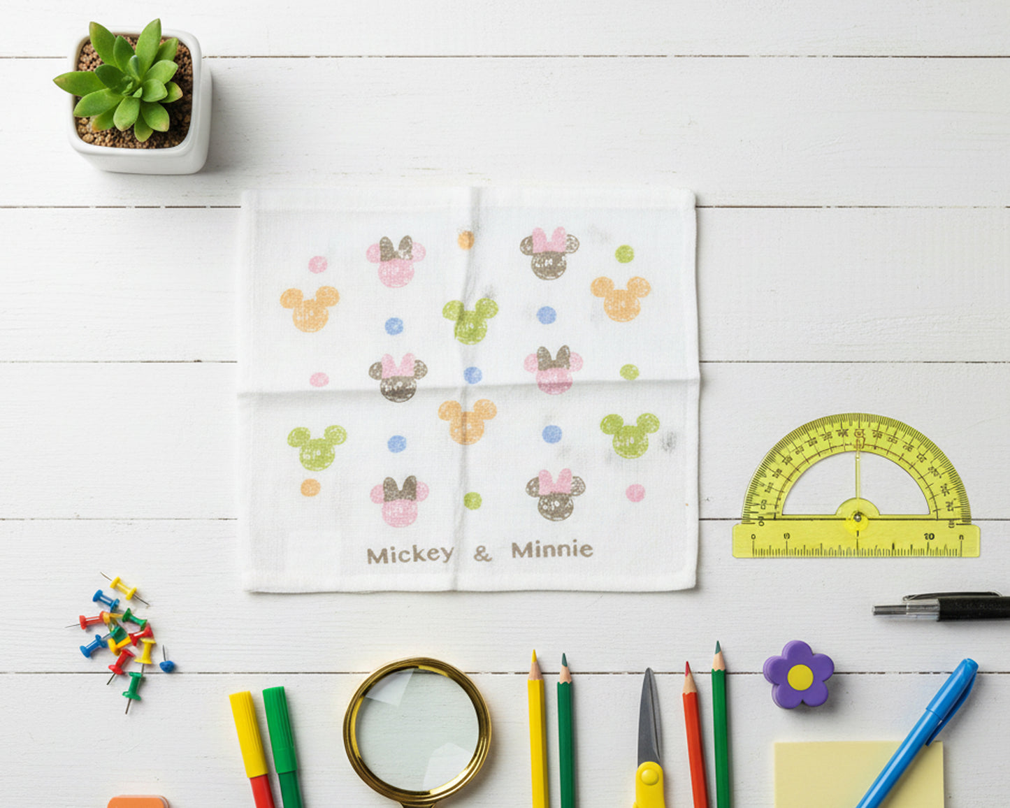 white cotton handkerchief with multi colored character icons