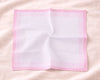 Pink mesh screen on a pink fabric background