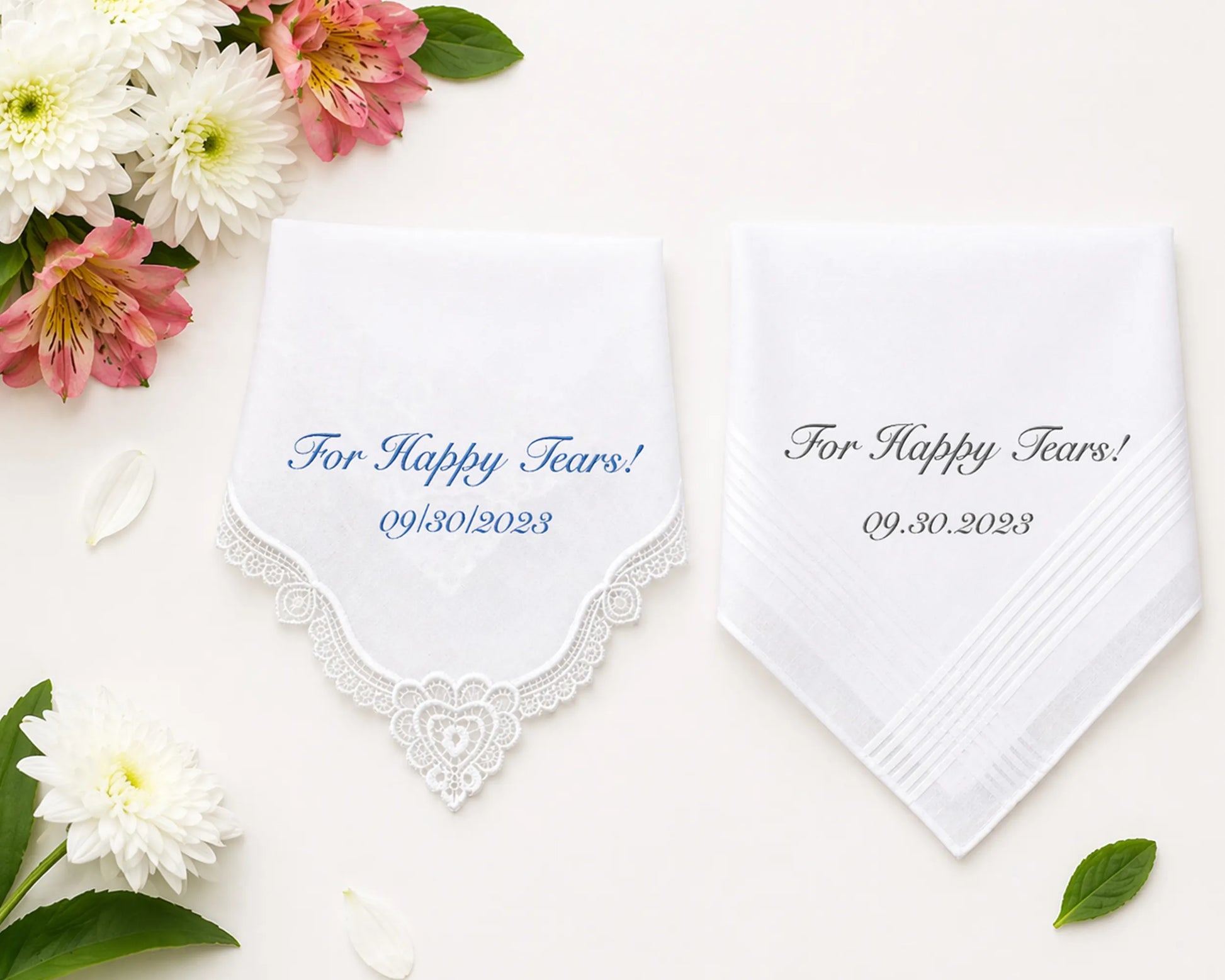 Set of plaid fabric swatches in pink, blue, and white on a marble surface with flowers.