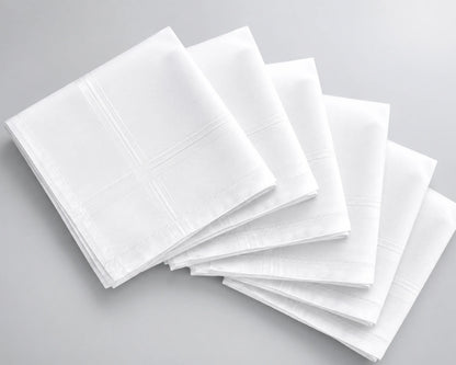 Stack of white hanky on a gray background