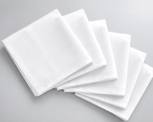 Stack of white hanky on a gray background
