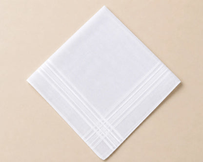 White hanky with subtle pattern on a beige background
